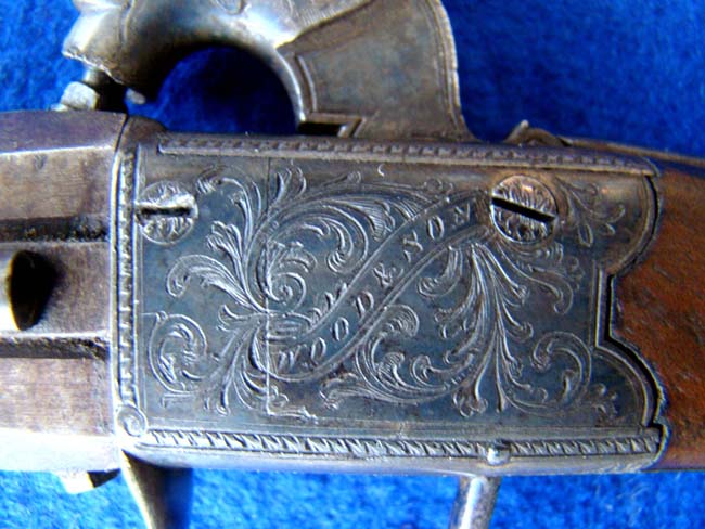An English .40 cal. percussion pocket pistol with swivel over and under barrells by Wood & Son, York, circa 1850 — image 3